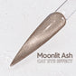 A close-up image of a nail polish swatch with a text overlay that reads "Moonlit Ash CAT EYE EFFECT".