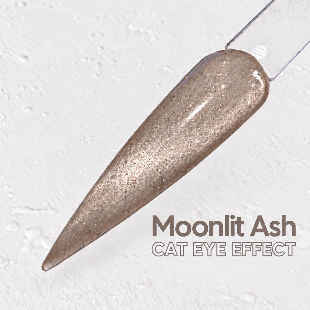 A close-up image of a nail polish swatch with a text overlay that reads "Moonlit Ash CAT EYE EFFECT".