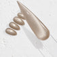 a close-up view of a glittery nail polish bottle and its nail polish swatches, with a focus on the nail polish bottle and its application.