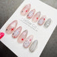A collection of colorful and artistic nail art designs, including stars and other decorative elements, displayed on a white background.