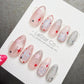 A collection of colorful and artistic nail designs, including stars and other decorative elements, displayed on a white background.