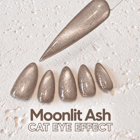 a collection of glittery nail polish bottles with a text overlay that reads "Moonlit Ash CAT EYE EFFECT".