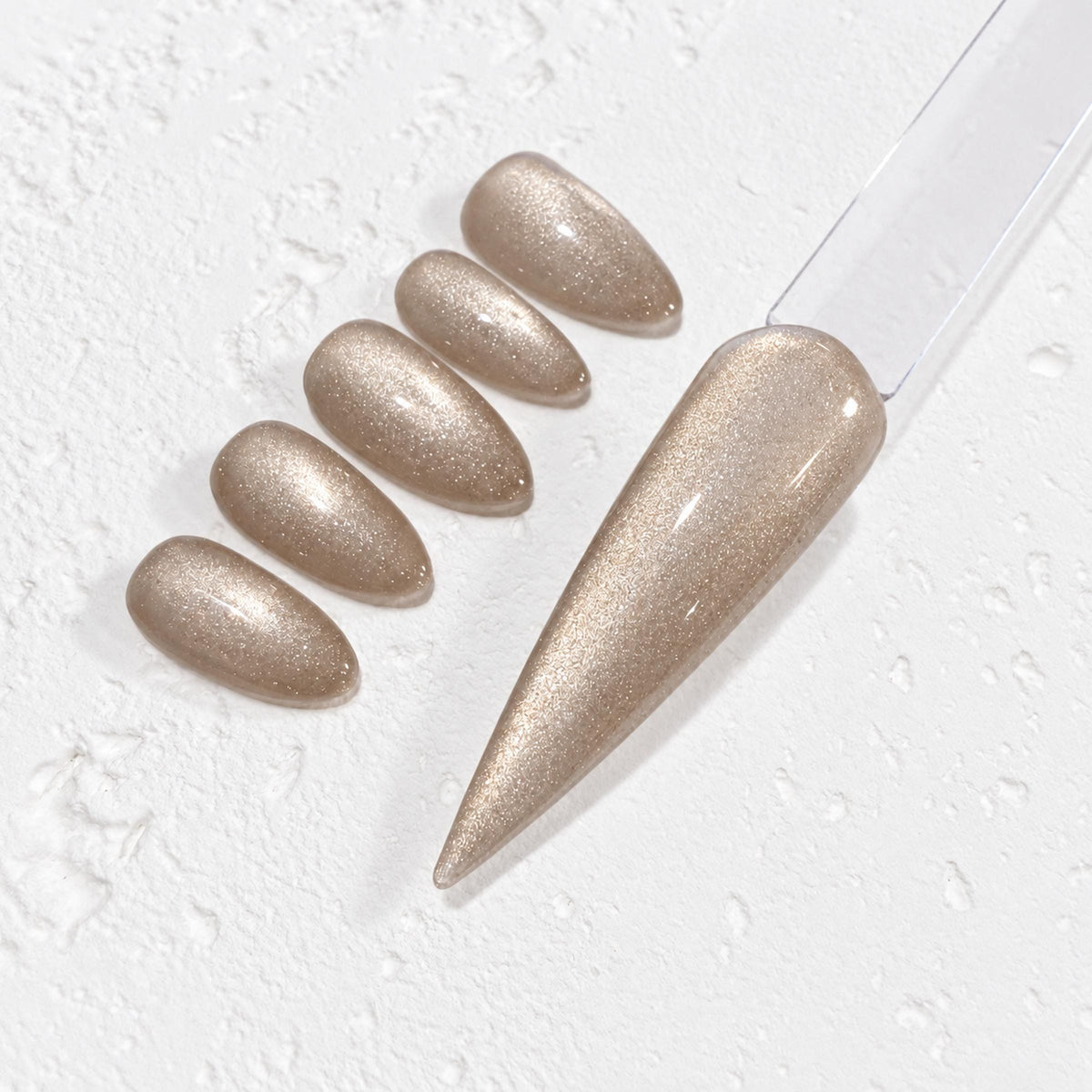 a collection of gold glitter nail polish bottles and a gold glitter nail polish swatch on a white background.